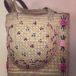 A beautiful handmade rose woven bag